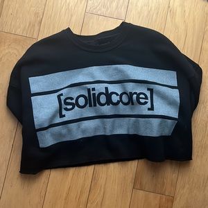 Black Solidcore crop sweatshirt, size medium.